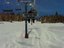 Snowboarder auf Lift